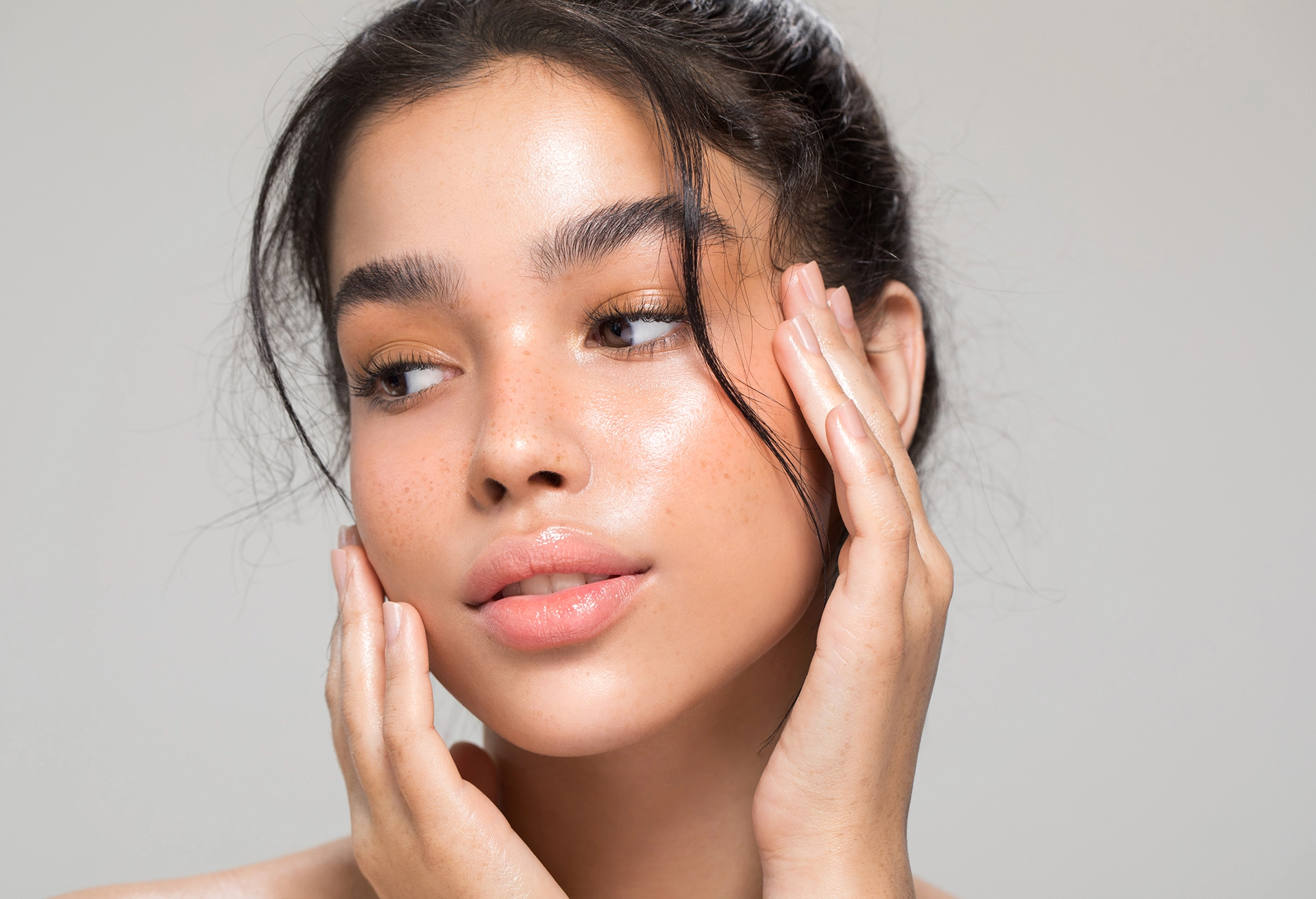 Woman with her hand on her face