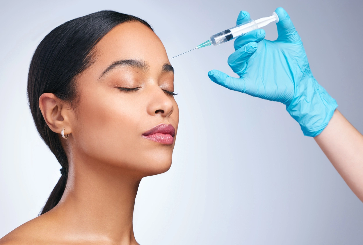 Woman recieving botox injections.